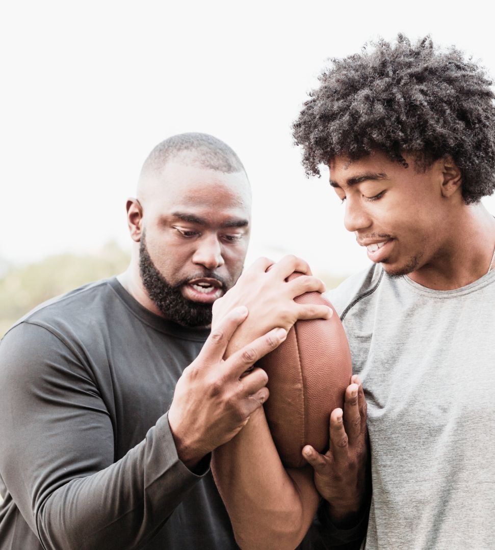 PHOTO OF COACH AND FOOTBALL PLAYER2